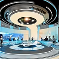 Modern Exhibition Hall With Circular Platform Large Screens Lighting Design And Visitors