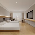Modern Hotel Guest Room With Twin Beds White Linens Wooden Flooring And Flat Screen TV