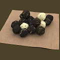Black and White Decorative Round Balls Arranged on Brown Textured Linen Cloth