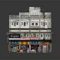 Traditional Two Story Commercial Building With Balconies And Colorful Storefront Awnings