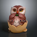 Brown And White Owl Figurine In Egg Shell With Green Accent And Yellow Eyes