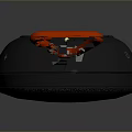 Portable JBL Computer Speaker With Black Circular Body Red Hook And Textured Surface