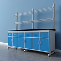 Functional Work Desk With Blue Cabinets Black Countertop And Metal Shelves