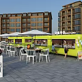Green Food Truck In Outdoor Dining Area With White Tables Chairs Umbrellas And Menu Board