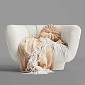 White Plush Accent Chair with Knitted Beige Cushion and Tasseled Blanket