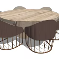 Round Wooden Dining Table Set With Six Brown Padded Chairs And Metal Mesh Legs