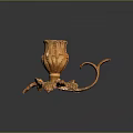 Golden Carved Decorative Candle Holder With Leaf Shaped Base And Curved Handle