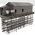 Traditional Wooden Stilt House With Clothes Hanging On Veranda And Elevated Structure