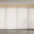 White Vertical Blinds Covering Large Window In Modern Interior Space With Light Filtering