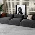 Modern Gray Corduroy Three-Seater Sofa With Decorative Pillows Potted Plant And Wall Art