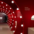 Red Arched Tunnel Interior With White Circular Lights Gray Floor And ICE Sign At End