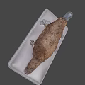 Game Movie Character With Fried Fish Like Look And Brown Crispy Surface On White Tray