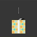 Opened Shiny Yellow Gift Box With Colorful Polka Dots Gray Ribbon And Blue Wrapping Paper