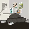 Comfortable Gray Bean Bag Chair With Books Potted Plant And Abstract Wall Art