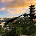 Ancient Chinese Pagoda Tower Surrounded By Trees Square And Flying Bird Under Sunset Sky