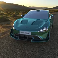 Green Sports Car Front View on Open Road with Mountain Landscape and Sunset Sky