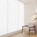 White Pleated Curtains in Bright Room with Wooden Armchair Floor Lamp and Green Plant