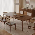 Modern Dining Room Interior With Wooden Table Woven Back Chairs Pendant Light And Sideboard