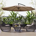 Woven Rattan Outdoor Sofa Set with Umbrella on Wooden Deck Surrounded by Green Plants
