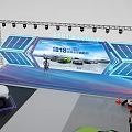 Colorful Car Models On Display Stands With Exhibition Setup And Different Hues