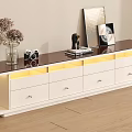 Modern White TV Stand with Dark Top Drawers and Decorative Vase Camera Sculpture
