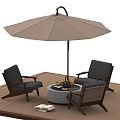 Outdoor Round Table With Fire Pit And Chairs Under Umbrella On Wooden Deck