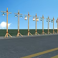 Outdoor Lights With Wooden Poles And Lantern Design Along Roadside Green Field