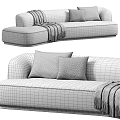 White and Brown Upholstered Double Sofa with Striped Throw Blanket and Gray Pillows