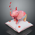 Pink Patchwork Elephant Toy Standing On White Pillow With Flower Decorations And Red Ribbons