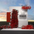Creative White Cube Art Installation With Red Floral Decor And Sunset Sky Backdrop