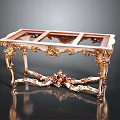 Ornate Classical Golden Coffee Table With Intricate Carved Legs And Glass Top
