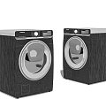 Two Modern Front Loading Washing Machines With Stainless Steel Finish And Sleek Design