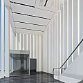 Modern Elevator Lobby Design With Escalator White Walls Black Marble Flooring And Large Windows