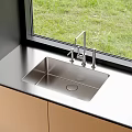 Stainless Steel Kitchen Sink In Modern Kitchen With Faucet Countertop And Grass View