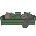 Green Velvet Two Seater Sofa With Decorative Pillows And Black Throw Blanket