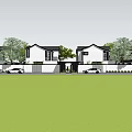 White Guesthouse Building With Black Roofs Front Lawn Trees And Parked Cars