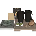 Black Ceramic Mugs With Face Designs On Wooden Tray With Coffee Beans Jars And Book