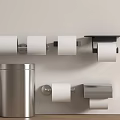 Sleek Bathroom Accessories With Wall Mounted Toilet Paper Holders And Modern Trash Can Design