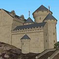 Ancient Castle Architecture With Towered Spires Perched On Hill Surrounded By Trees And Water