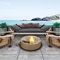 Outdoor Sofa With Wooden Chairs And Flaming Fire Pit On Beach Backdrop With Green Plants