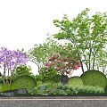 Beautiful Garden Flowers With Purple Pink Blooms Green Shrubs Stones And Small Plants On Grass