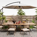 Outdoor Dining Table With Rattan Chairs Umbrella Plants Bamboo Fence And Fruit Bowl