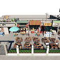 Commercial Street With Outdoor Dining Tables Umbrella Store Signs Green Plants And Fence