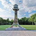 Sculptural Spirit Fortress With Stone Base Standing On Green Lawn Against Blue Sky And Trees