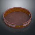 Traditional Circular Decorative Container With Ornate Patterns And Colorful Borders