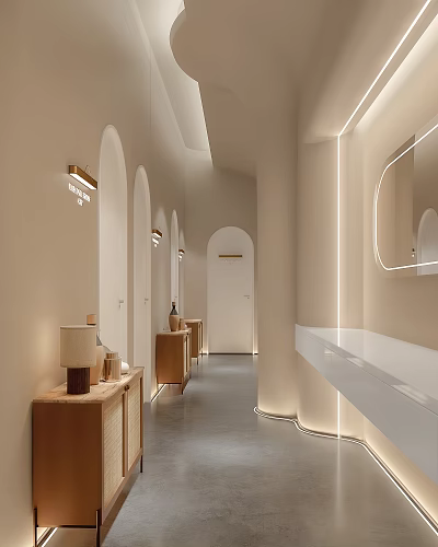 Hotel Corridor With Arched Doorways Recessed Lighting And Wooden Side Cabinets 3d model