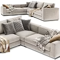 Plush Sectional Sofa With Cozy Blanket And Decorative Pillows In Neutral Tone