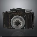 Vintage Camilla 2 Camera Electronic Device With Retro Design Black Body And Silver Lens