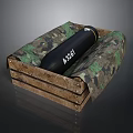 Black Cylindrical Weapon Marked ASSAI Placed in Wooden Crate with Camouflage Padding