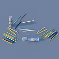 Colorful Drawing Pencils Scattered with Open and Closed Transparent Cases on Blue Background